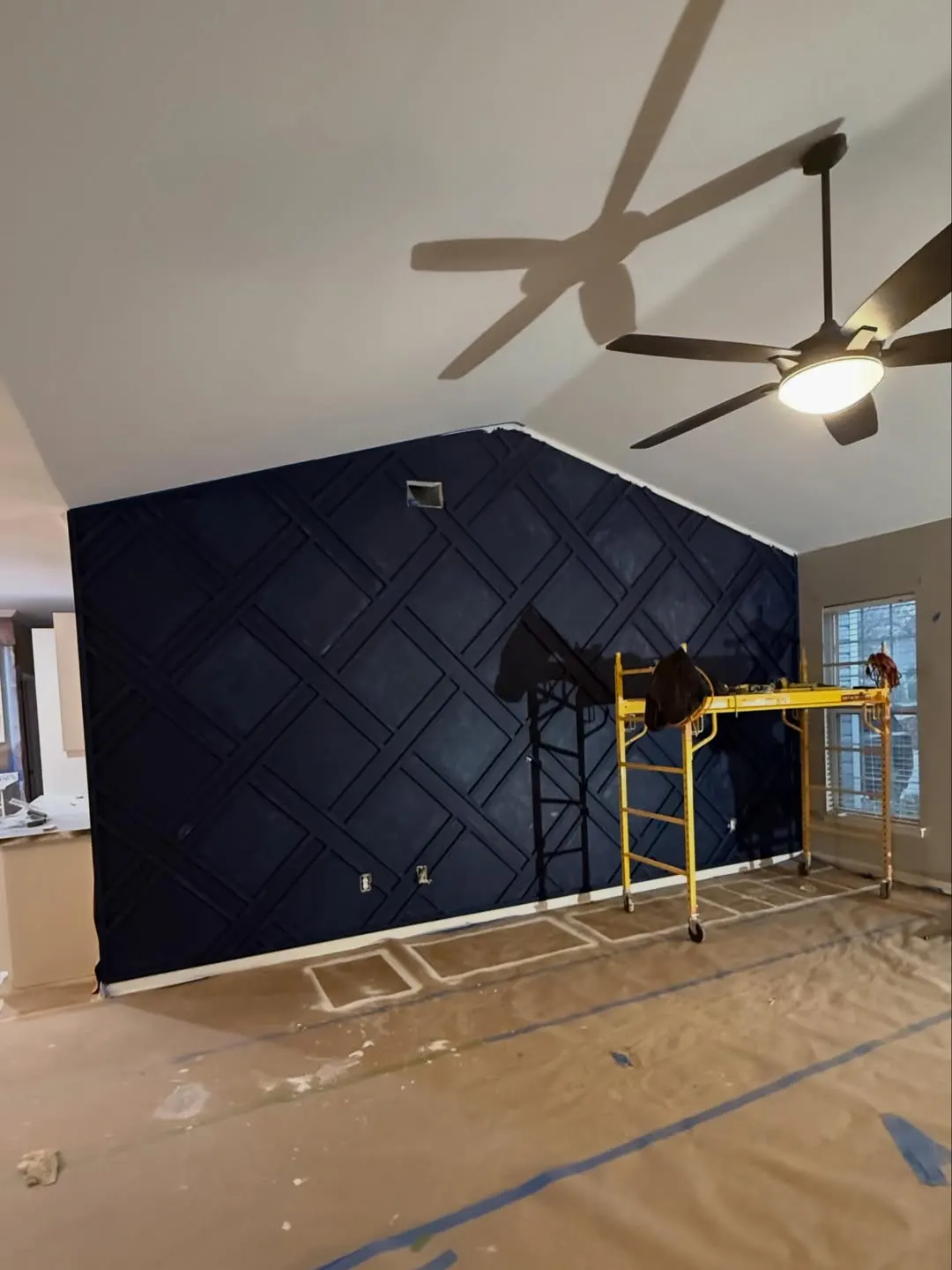 Accent wall with lattice trim painted navy blue